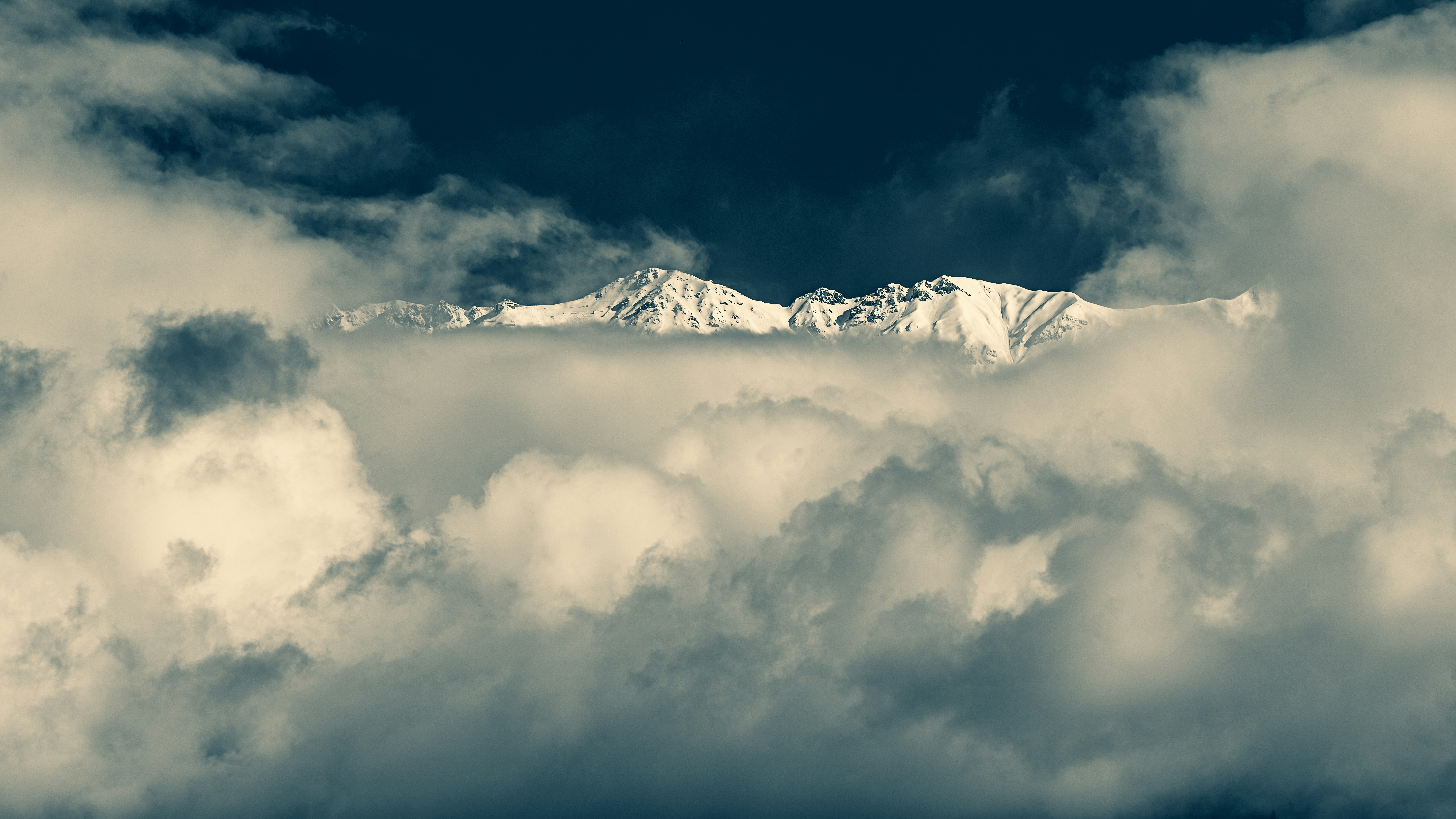 snow mountain covered with clouds